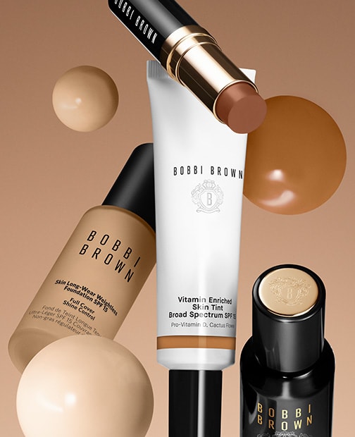 Visual of close up visual of foundation bottle foundation stick and spf foundation 